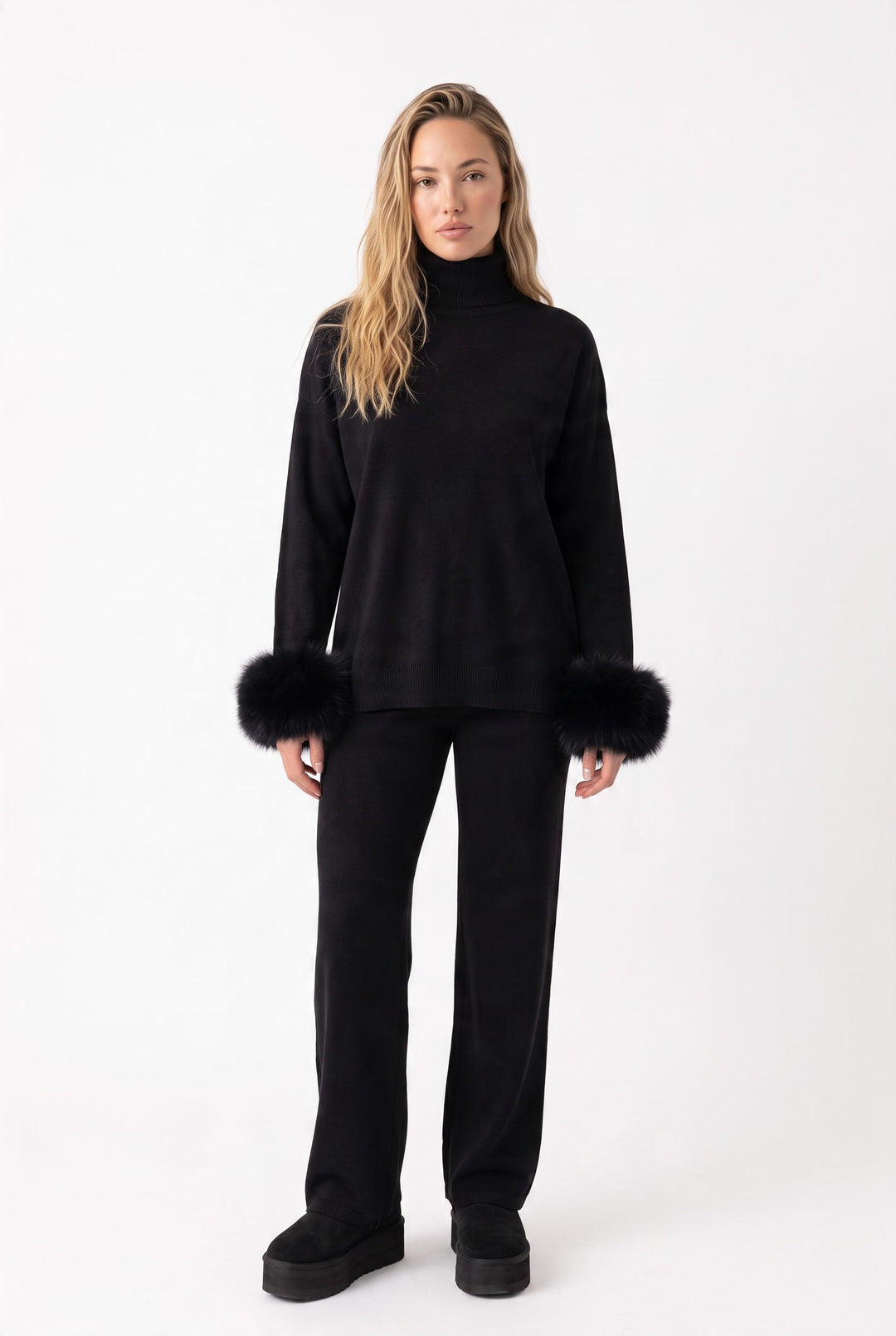 lily Ivy black knit lounge set with turtleneck and removable real fox fur cuffs on a model