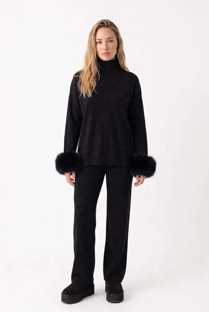 lily Ivy black knit lounge set with turtleneck and removable real fox fur cuffs on a model