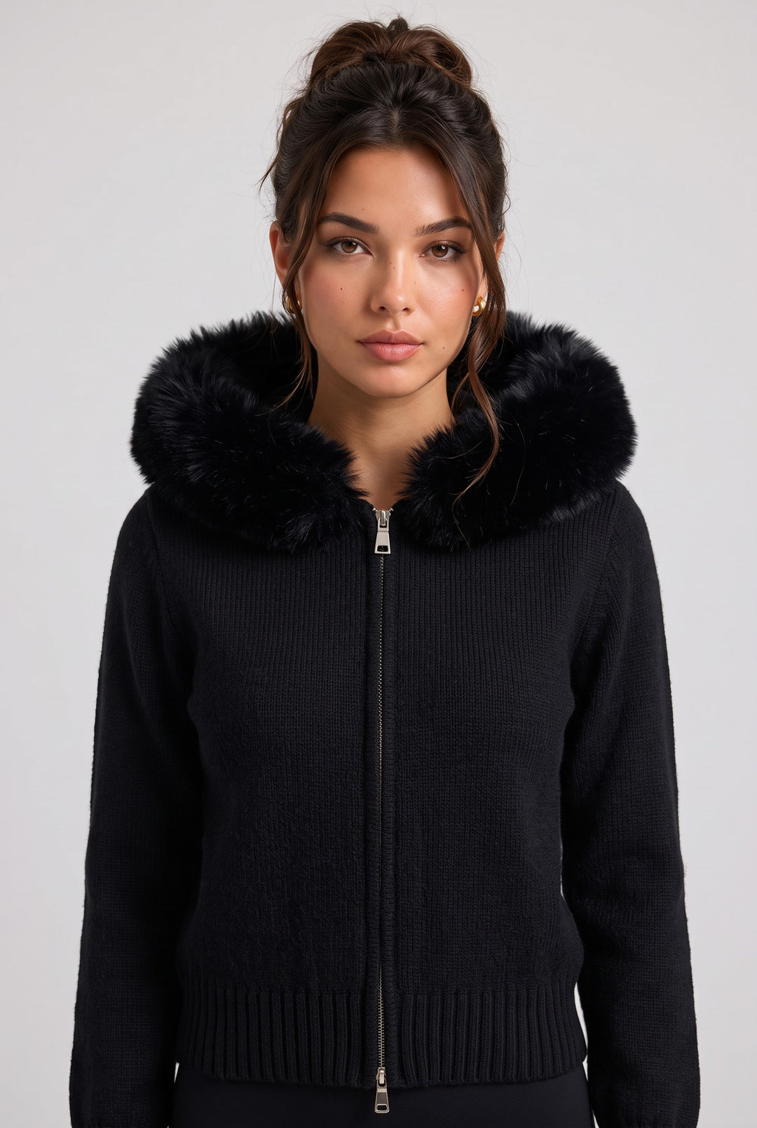 lily black knitted zip-up jacket with a plush faux fur hood worn by a woman against a neutral background